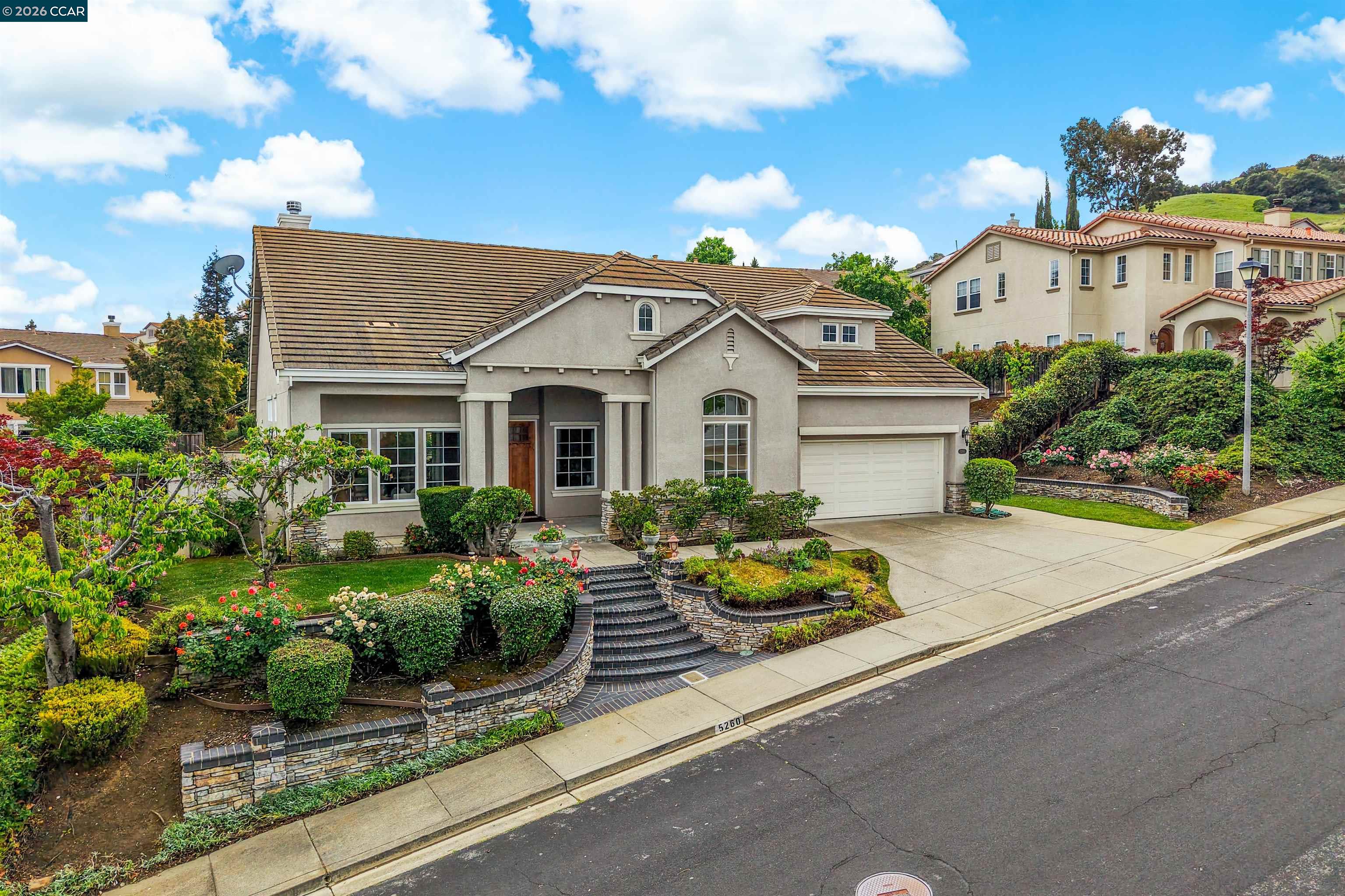 5260 Hiddencrest Court Concord, CA 94521 - Photo 70 of 87 a front view of a house with a yard and potted plants