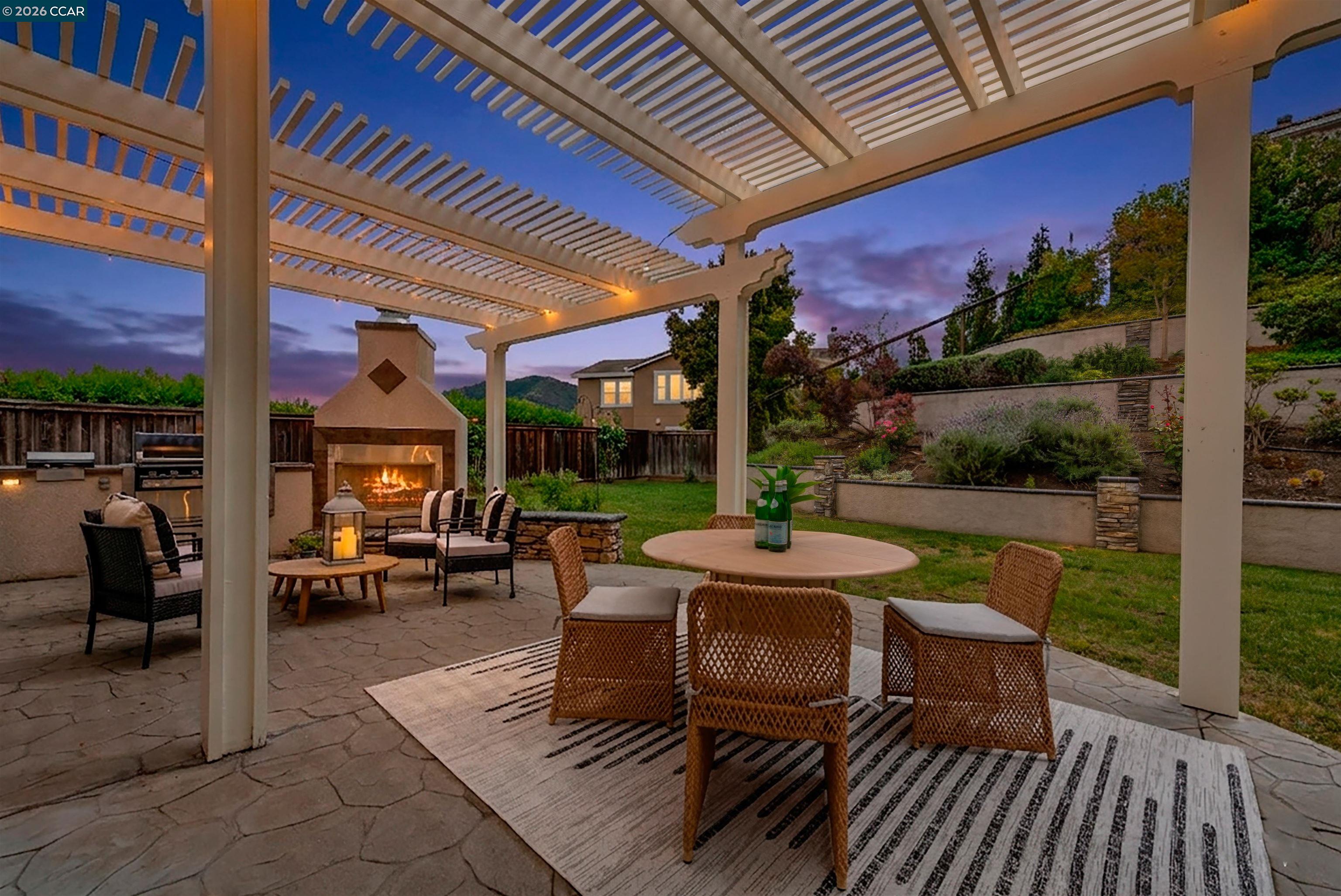 5260 Hiddencrest Court Concord, CA 94521 - Photo 76 of 87 a view of a patio with couches and table and chairs and potted plants
