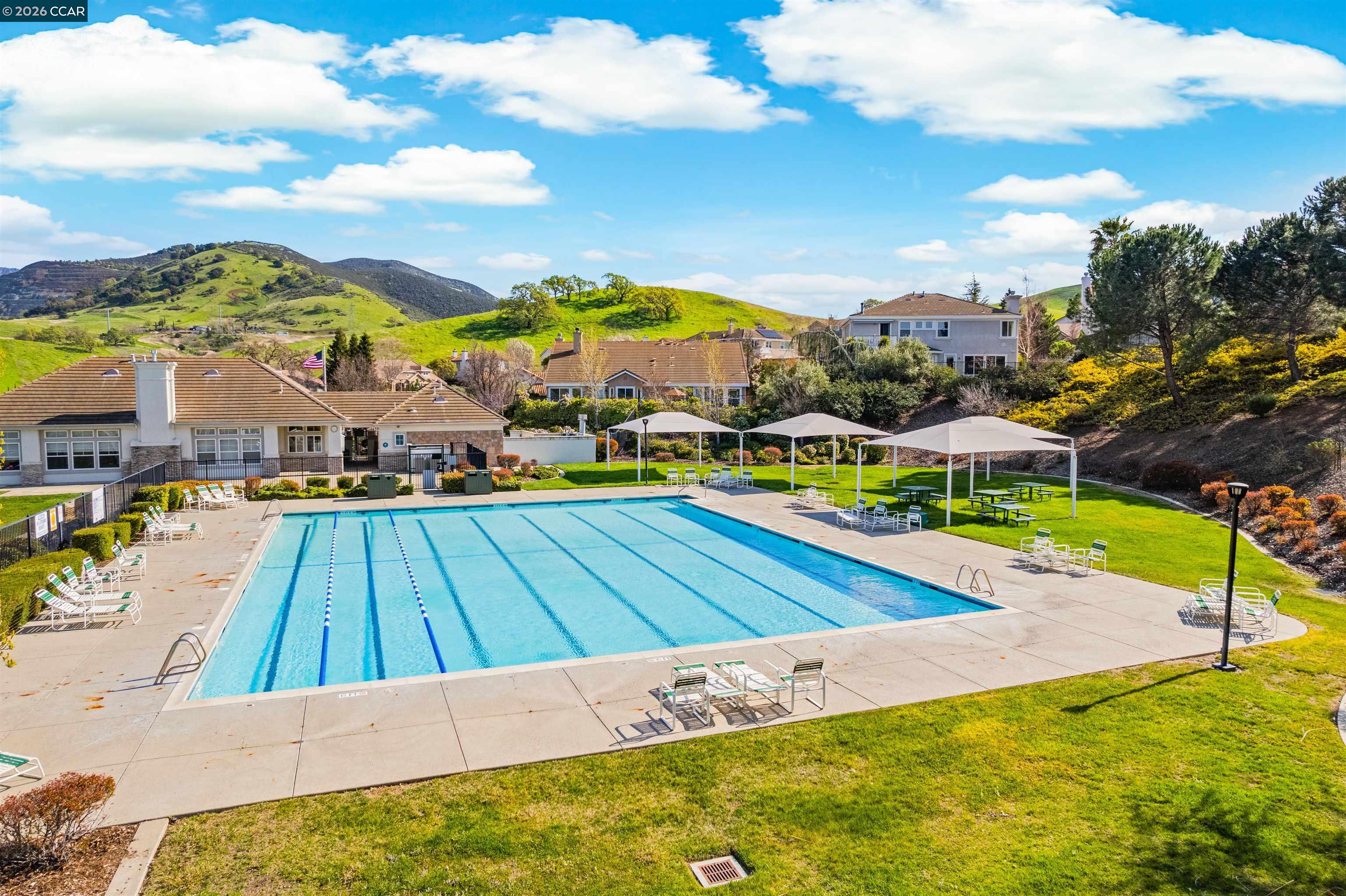 5260 Hiddencrest Court Concord, CA 94521 - Photo 79 of 87 a view of an swimming pool with an outdoor space and seating area