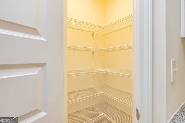 a kitchen with a sink stainless steel appliances and cabinets