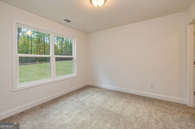 an empty room with closet area