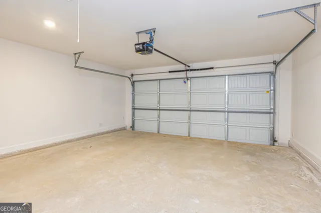a view of a house with a yard and large tree