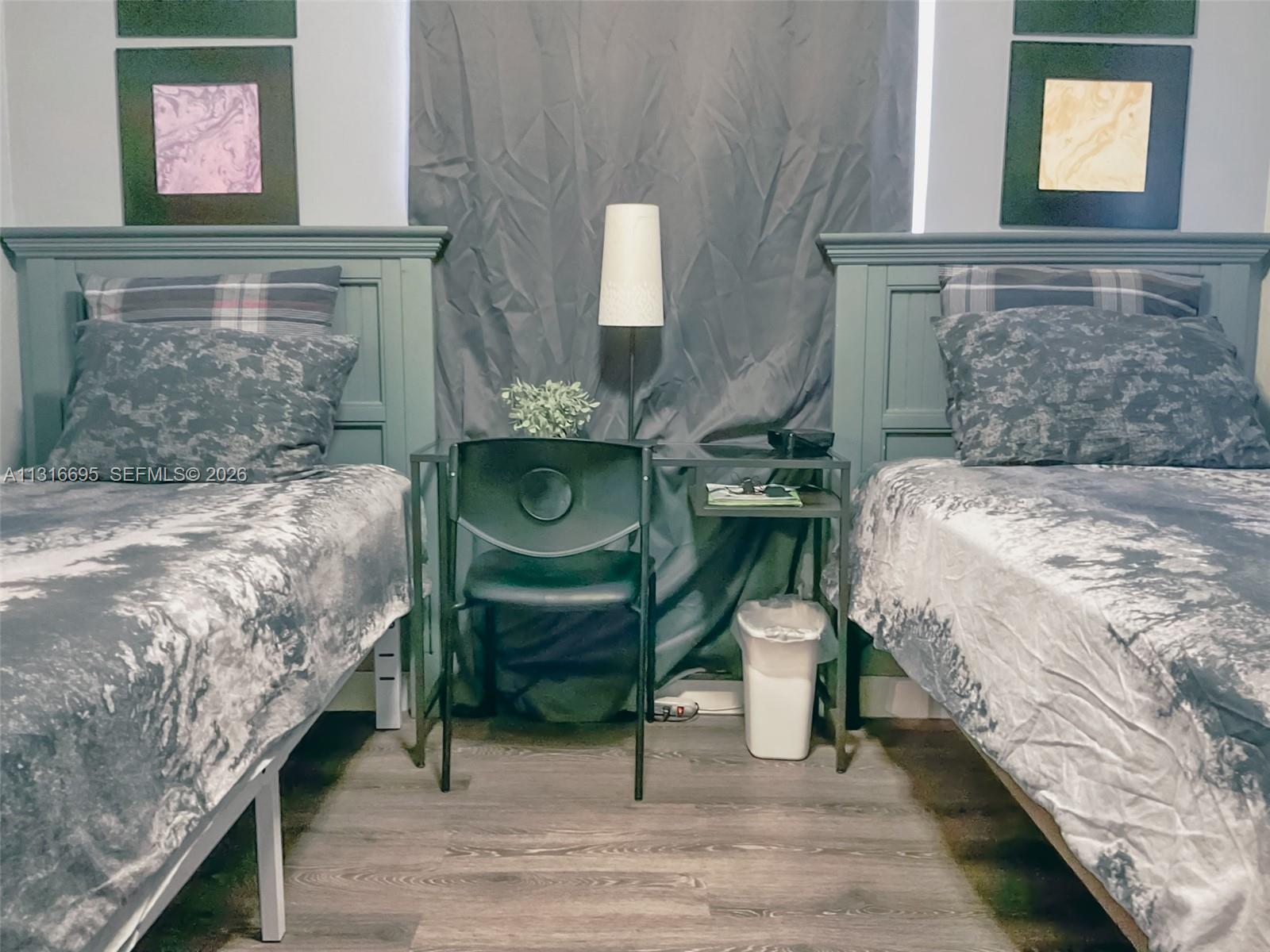 3682 Southwest 26th Street, Unit 2 Miami, FL 33133 - Photo 20 of 23 a bedroom with a bed and a mirror on the dresser