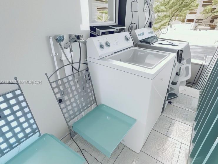 3682 Southwest 26th Street, Unit 2 Miami, FL 33133 - Photo 22 of 23 a utility room with dryer and washer