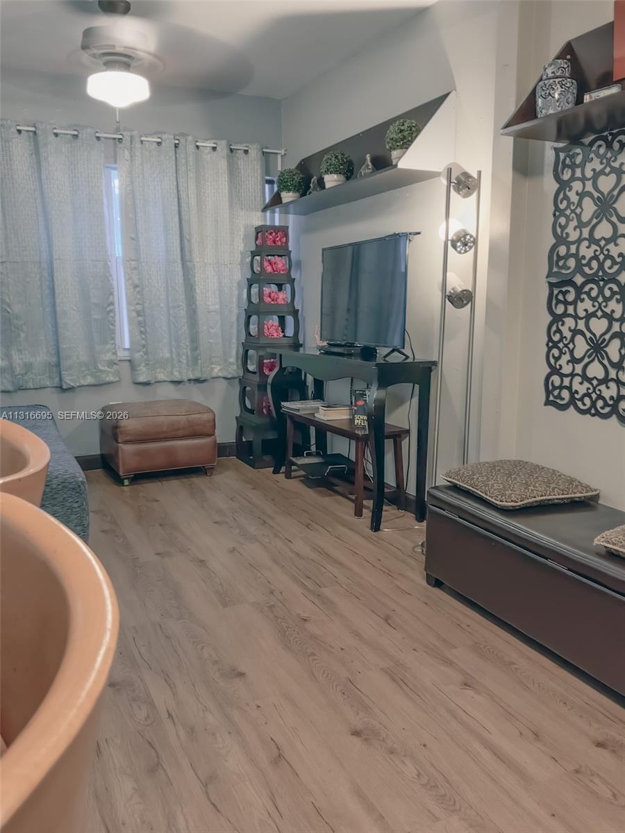 3682 Southwest 26th Street, Unit 2 Miami, FL 33133 - Photo 8 of 23 a living room with furniture and a flat screen tv