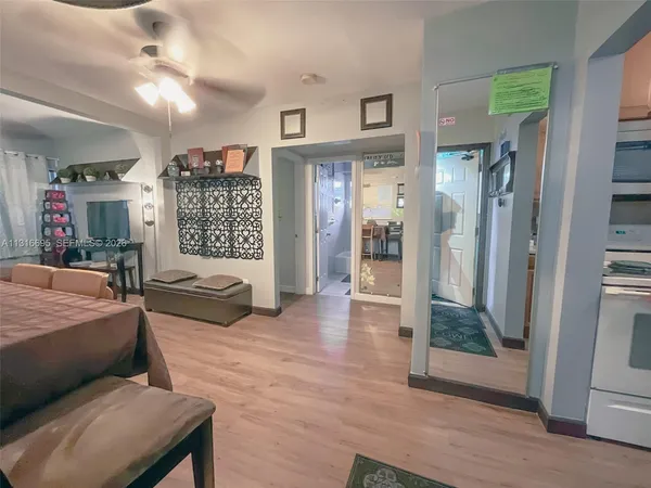 a bedroom with furniture and a wooden floor