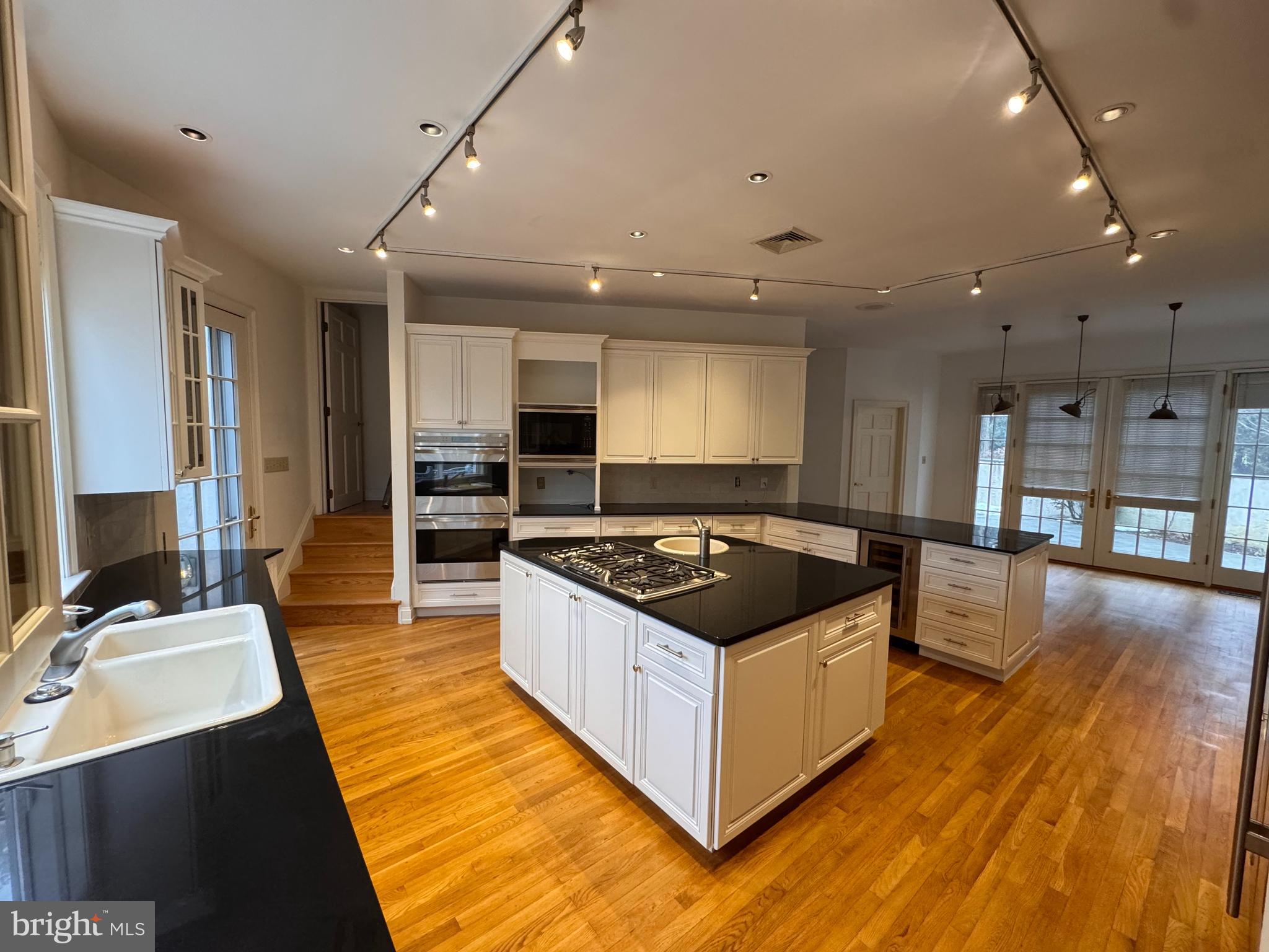 841 Mt Moro Road Villanova, PA 19085 - Photo 15 of 57 a kitchen with stainless steel appliances granite countertop a stove and a sink
