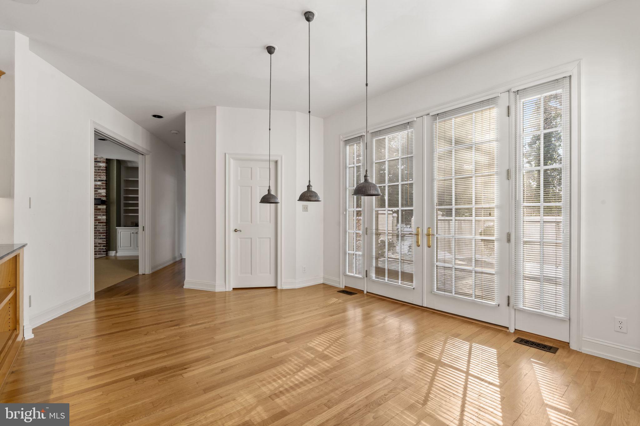 841 Mt Moro Road Villanova, PA 19085 - Photo 21 of 57 a view of an empty room with wooden floor and a window