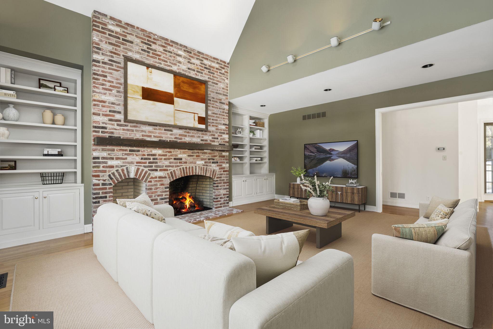 841 Mt Moro Road Villanova, PA 19085 - Photo 23 of 57 a living room with furniture and a fireplace