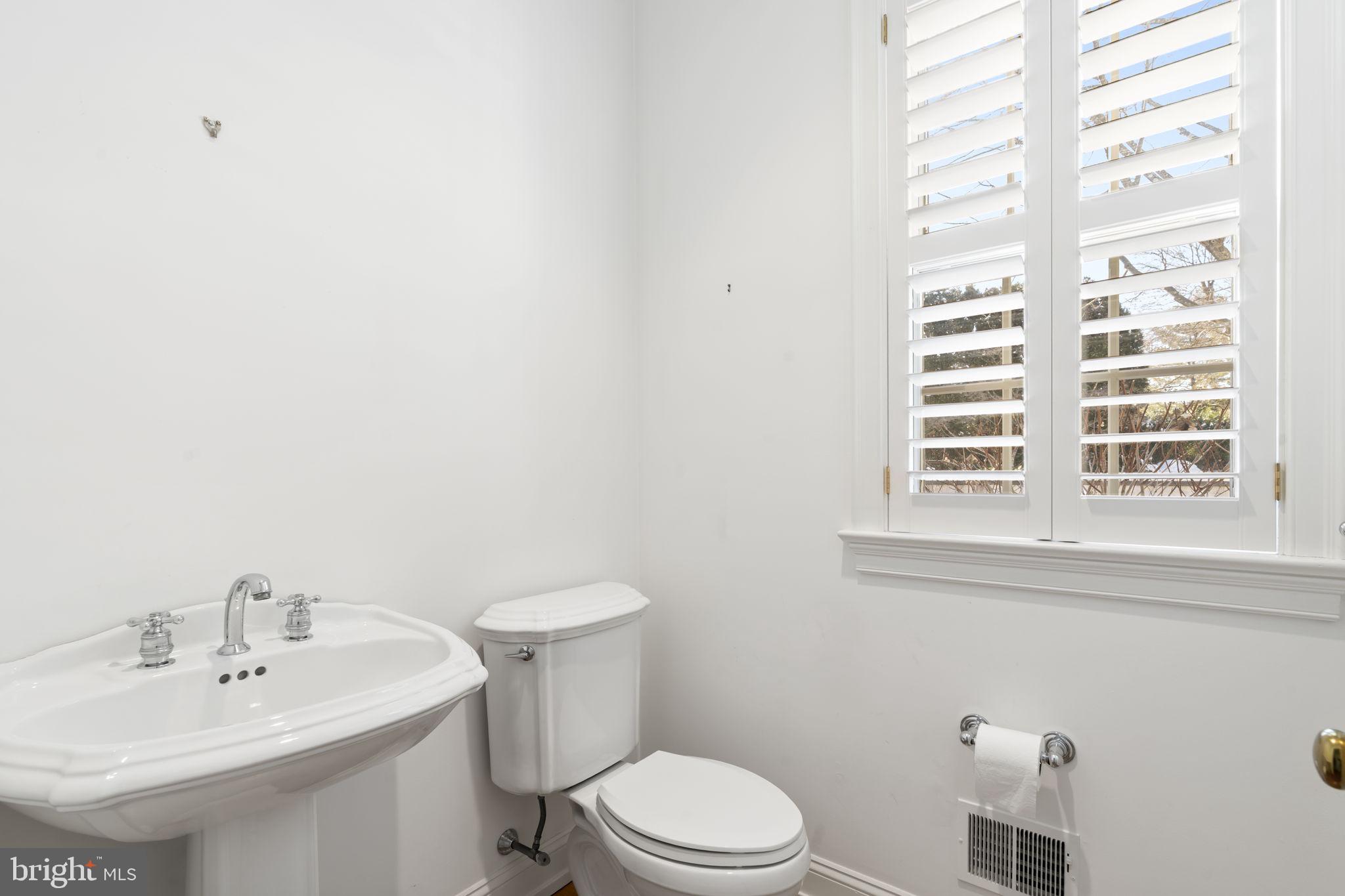 841 Mt Moro Road Villanova, PA 19085 - Photo 25 of 57 a bathroom with a sink a toilet and a window