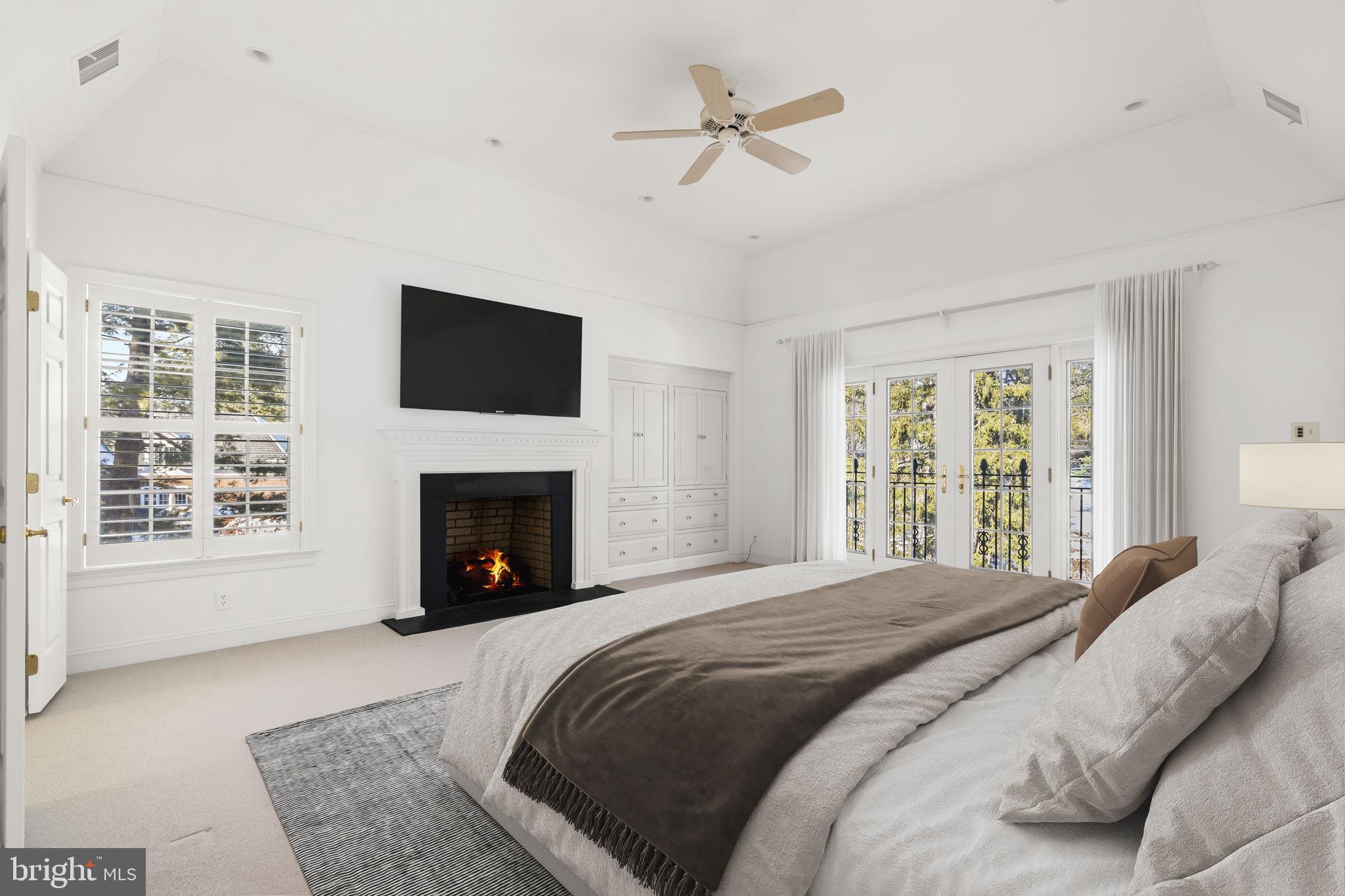 841 Mt Moro Road Villanova, PA 19085 - Photo 28 of 57 a bedroom with a bed and a fireplace