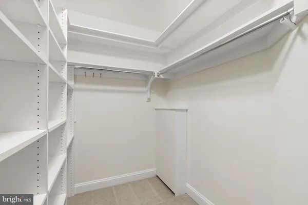 a spacious bathroom with double sink and a mirror