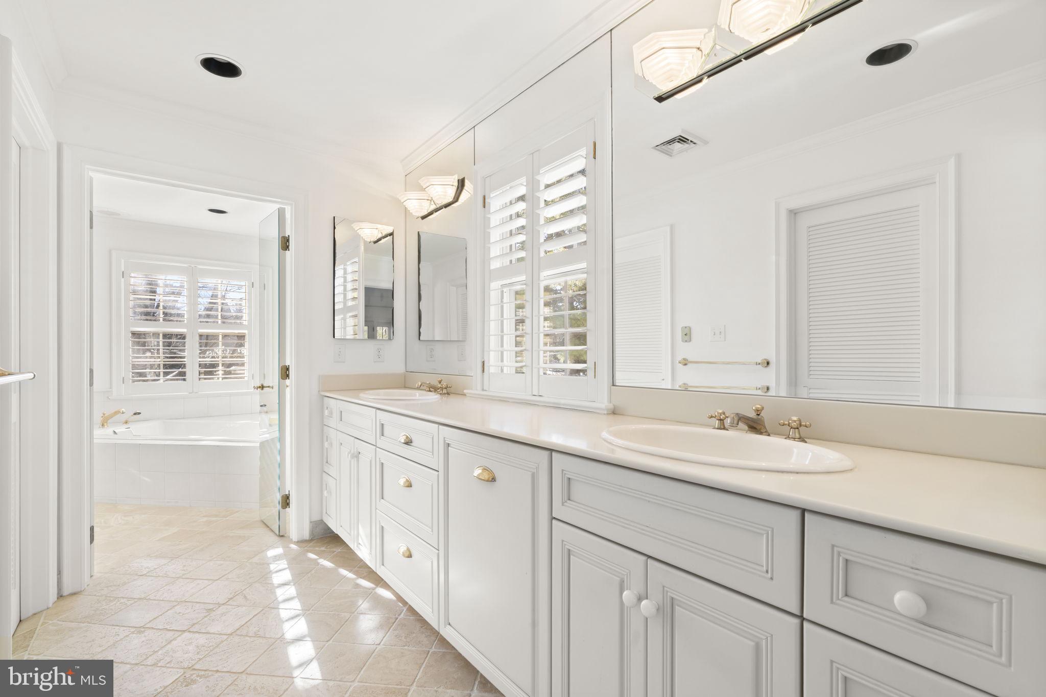 841 Mt Moro Road Villanova, PA 19085 - Photo 34 of 57 a spacious bathroom with double sink and a mirror