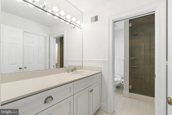 a utility room with closet and window