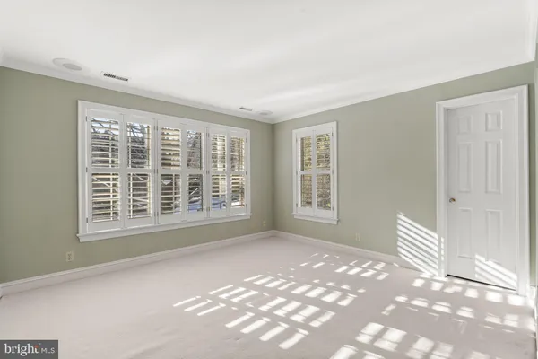 a utility room with closet and window