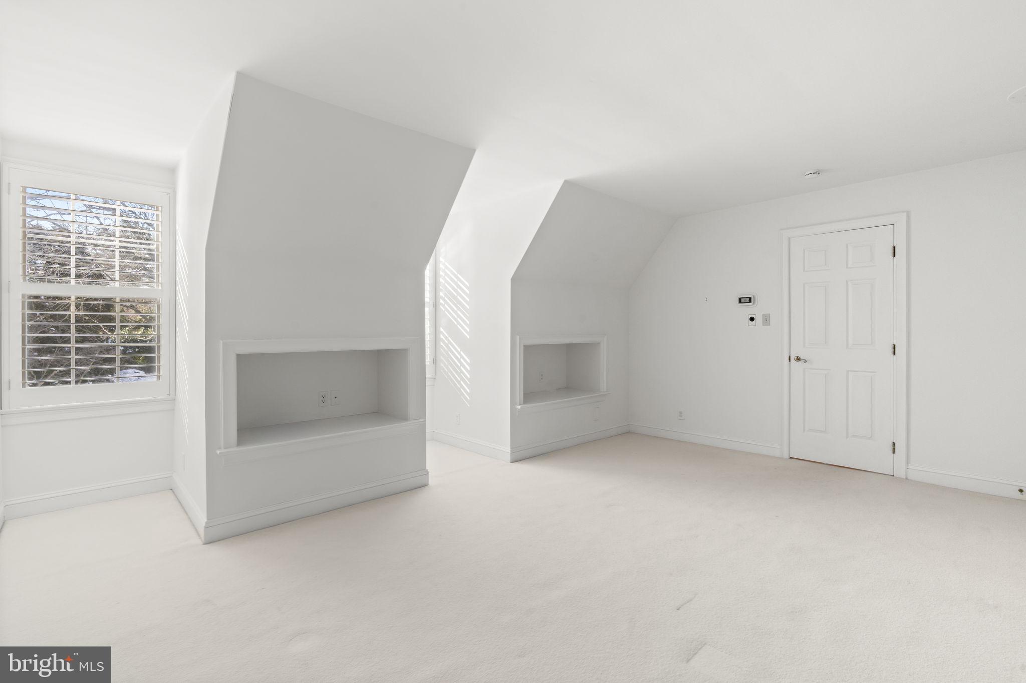 841 Mt Moro Road Villanova, PA 19085 - Photo 40 of 54 an empty room with a fireplace