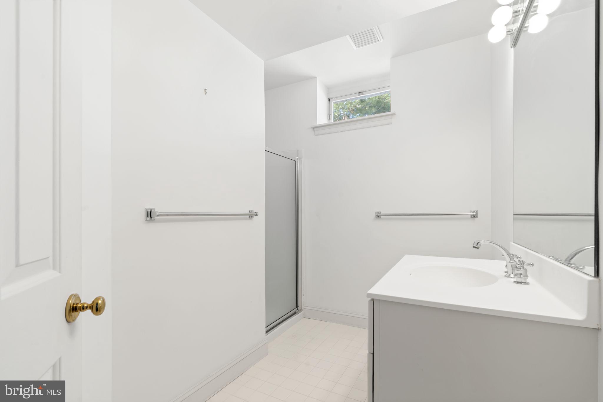 841 Mt Moro Road Villanova, PA 19085 - Photo 57 of 62 a bathroom with a sink and mirror