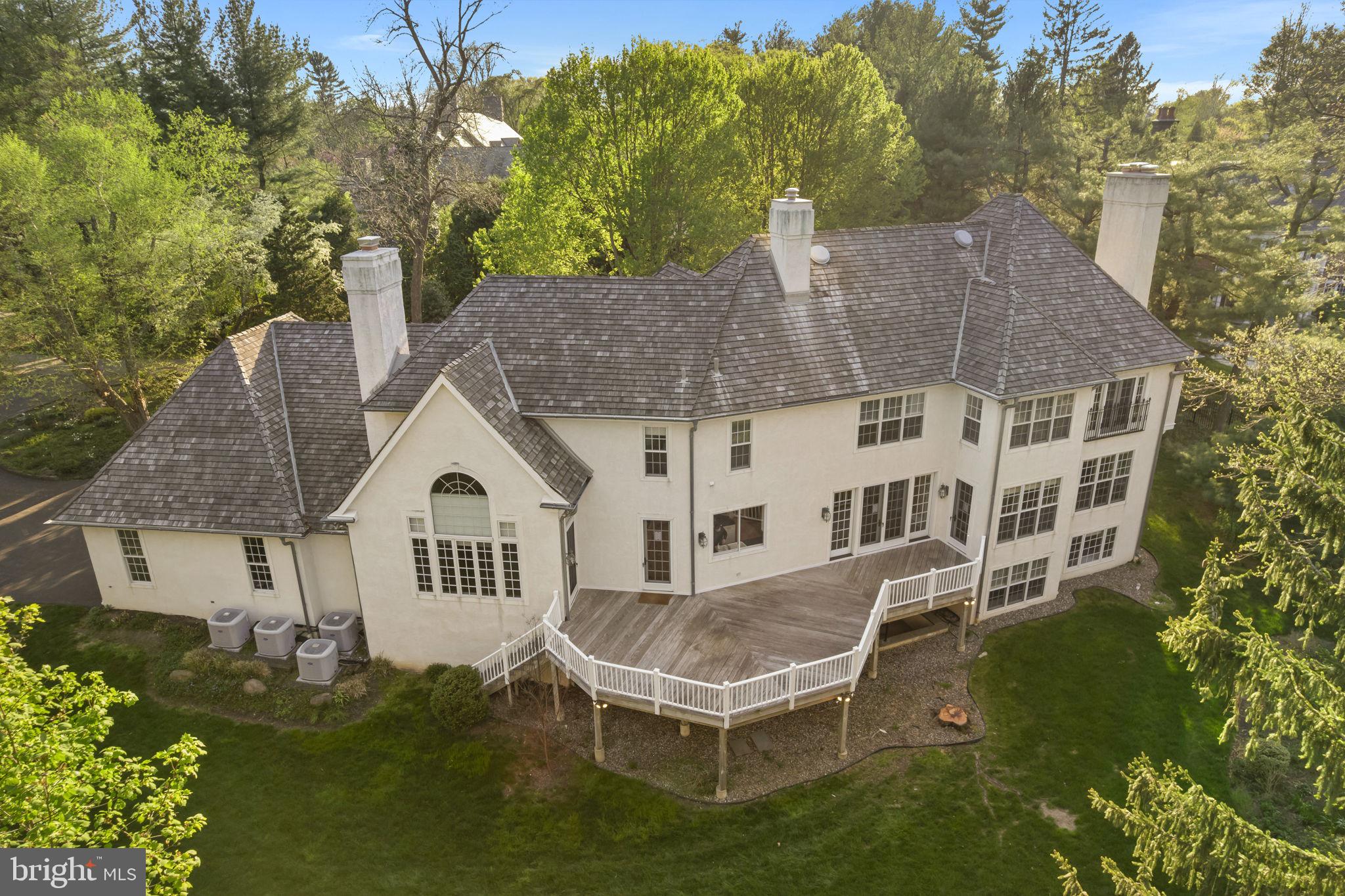 841 Mt Moro Road Villanova, PA 19085 - Photo 58 of 62 a aerial view of a house with a yard table and chairs