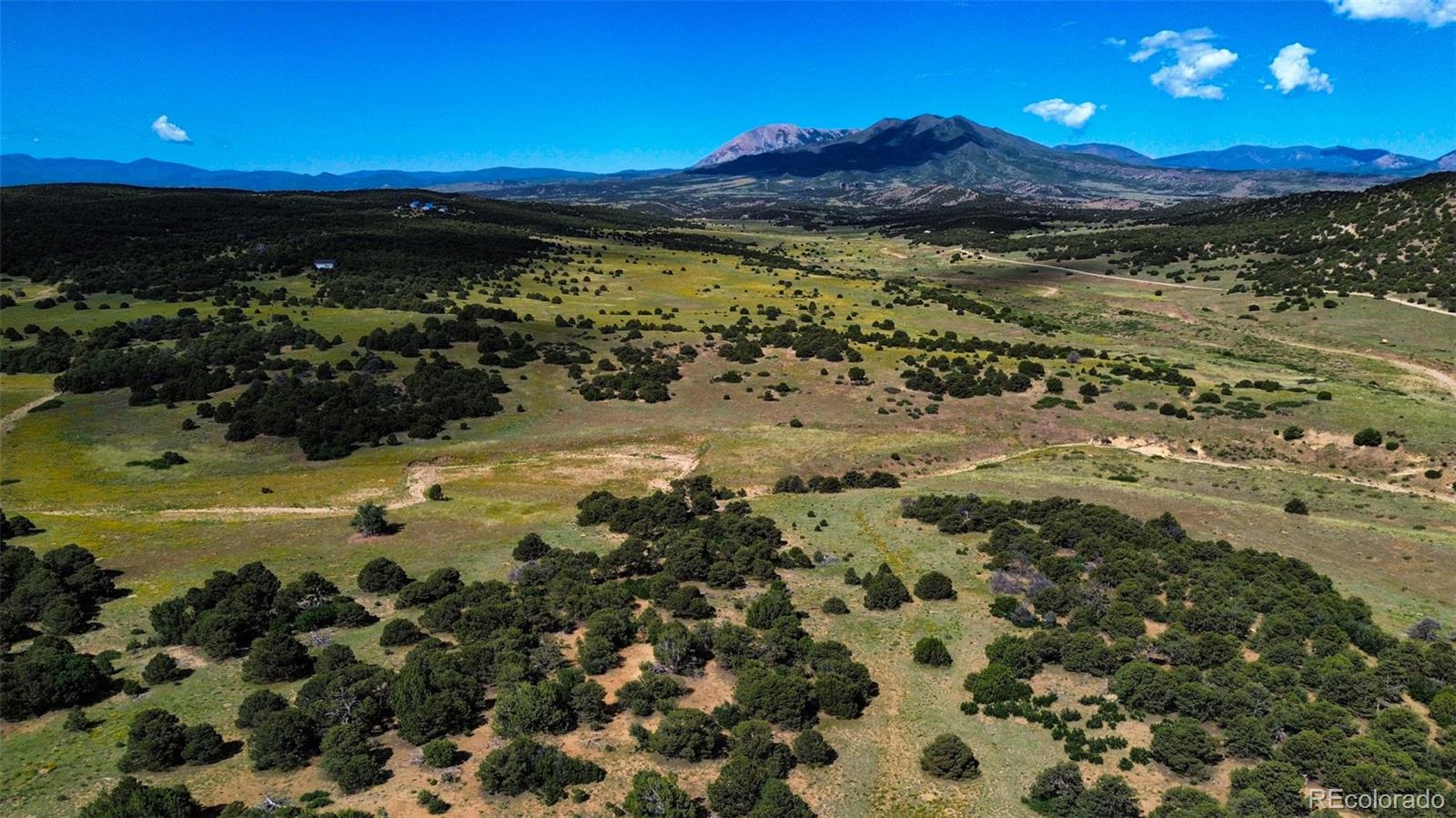 363 Black Hills Road Walsenburg, CO 81089 - Photo 11 of 30 a view of a lake with a beach