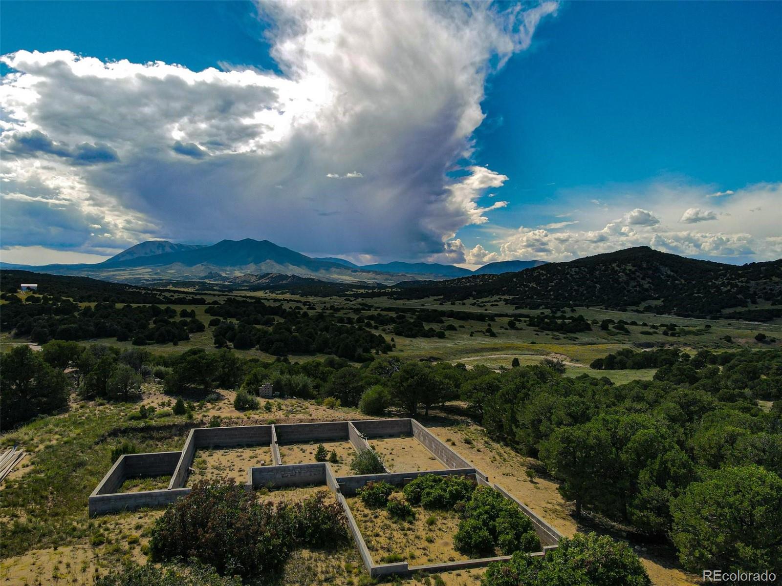 363 Black Hills Road Walsenburg, CO 81089 - Photo 22 of 30 a view of a city with lots of residential buildings ocean and mountain view in back