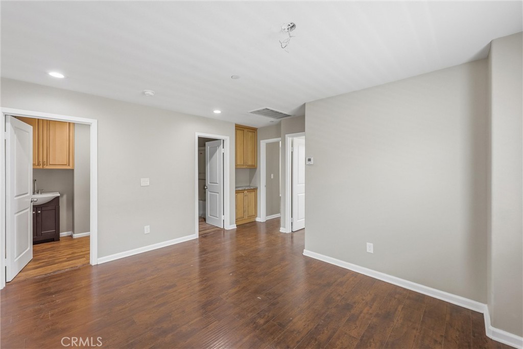 956 West Tibbot Street Rialto, CA 92377 - Photo 31 of 37 a view of an empty room with wooden floor