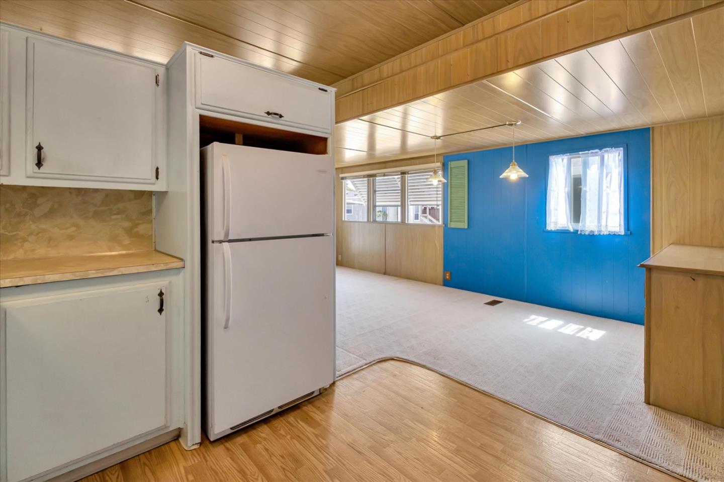 4160 Jade Street, Unit 74 Capitola, CA 95010 - Photo 12 of 25 a view of empty room with wooden floor and cabinets