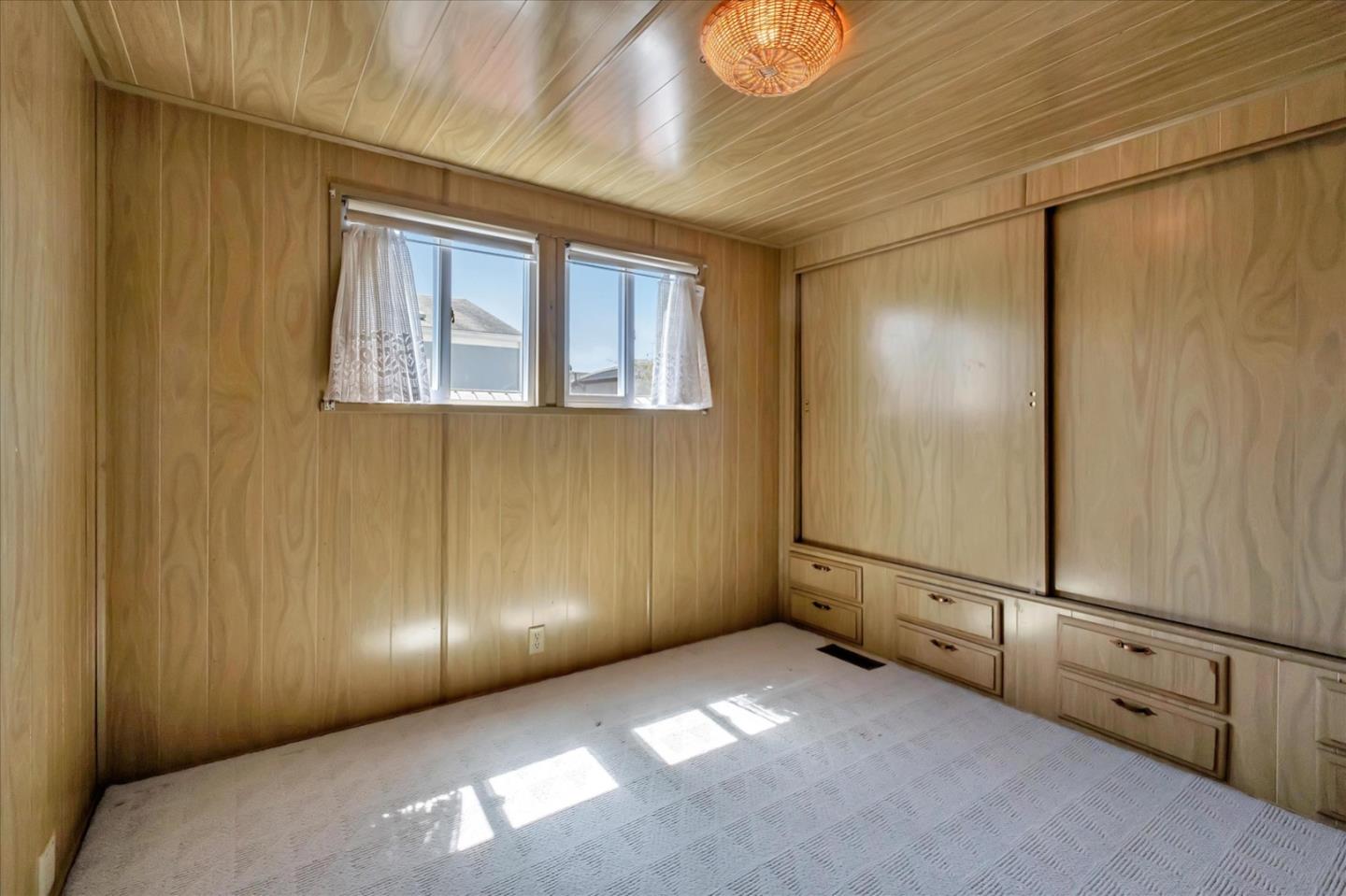 4160 Jade Street, Unit 74 Capitola, CA 95010 - Photo 17 of 25 a view of an empty room with wooden floor