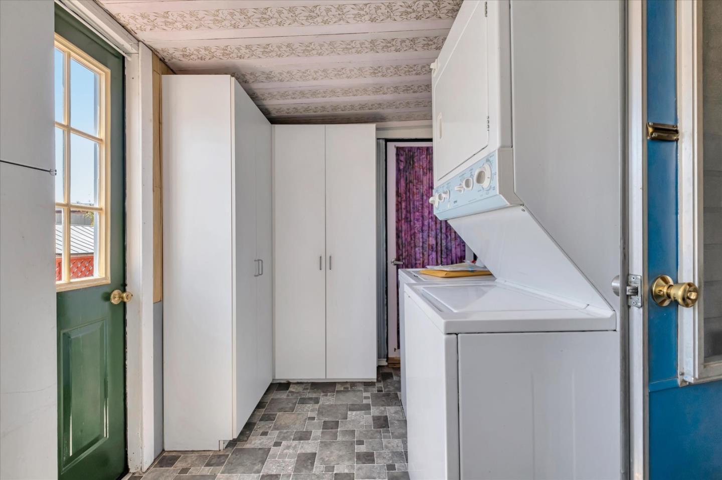 4160 Jade Street, Unit 74 Capitola, CA 95010 - Photo 21 of 25 a room that has a rug and a white door