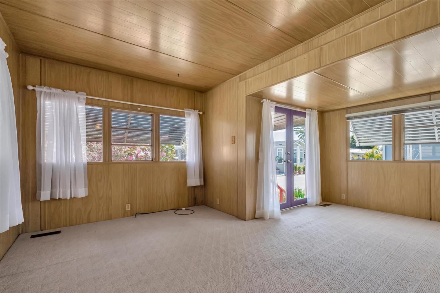 4160 Jade Street, Unit 74 Capitola, CA 95010 - Photo 6 of 25 an empty room with windows