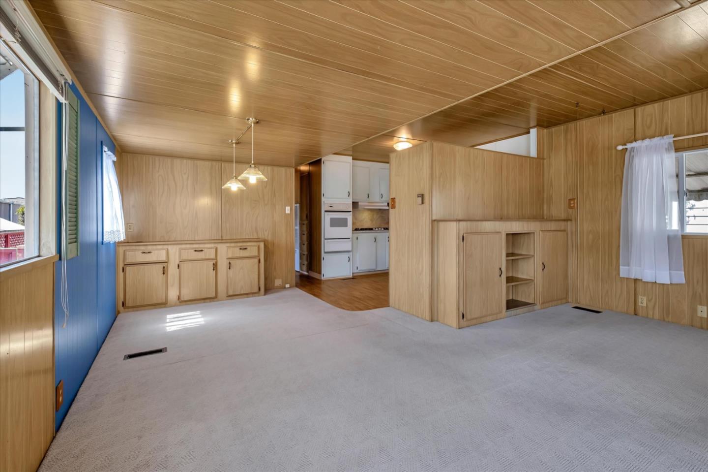 4160 Jade Street, Unit 74 Capitola, CA 95010 - Photo 7 of 25 a view of a kitchen with a refrigerator and a microwave