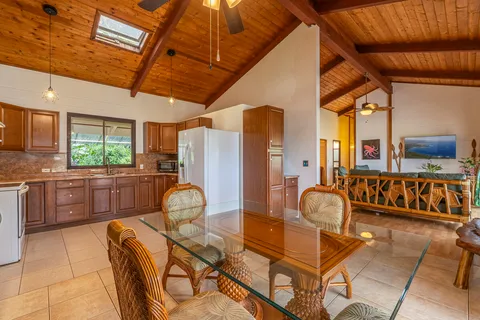 a room with furniture a flat screen tv and a large window