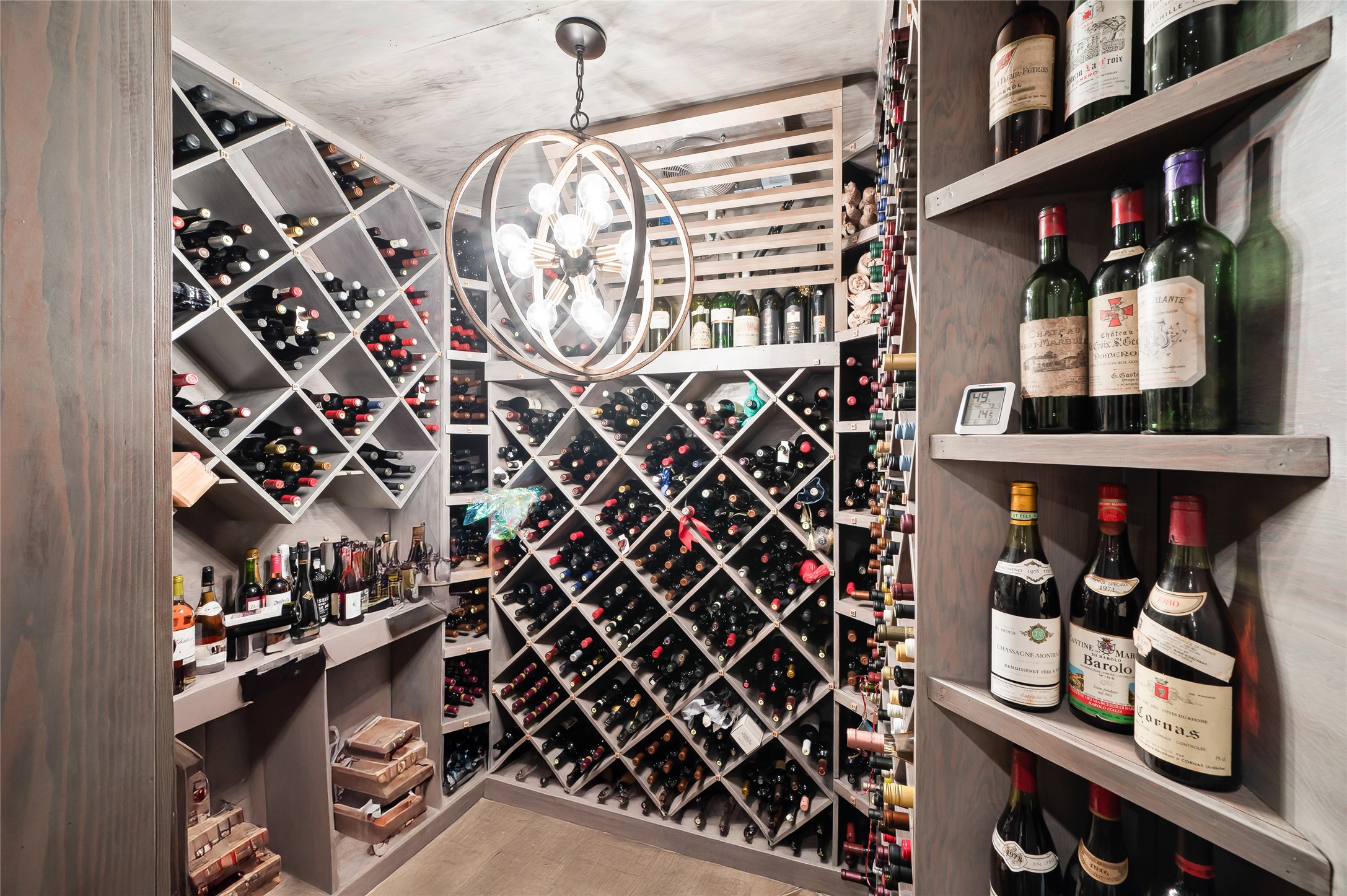 11518 Shadow Way Street Houston, TX 77024 - Photo 28 of 50 The refrigerated wine room offers custom storage for hundreds of bottles, combining functionality with striking visual appeal, ideal for collectors and entertainers.