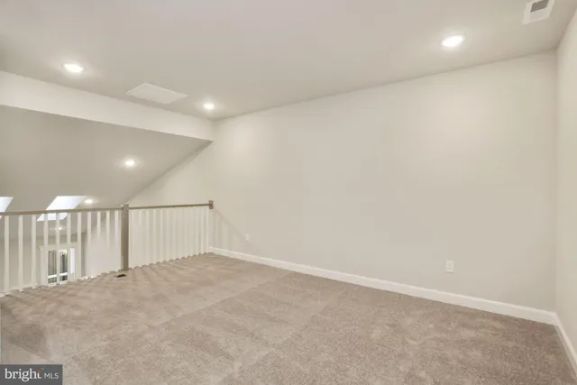 an empty room with wooden floor