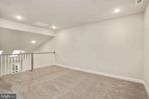 an empty room with wooden floor