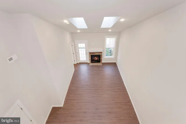 wooden floor in a hall with a fireplace