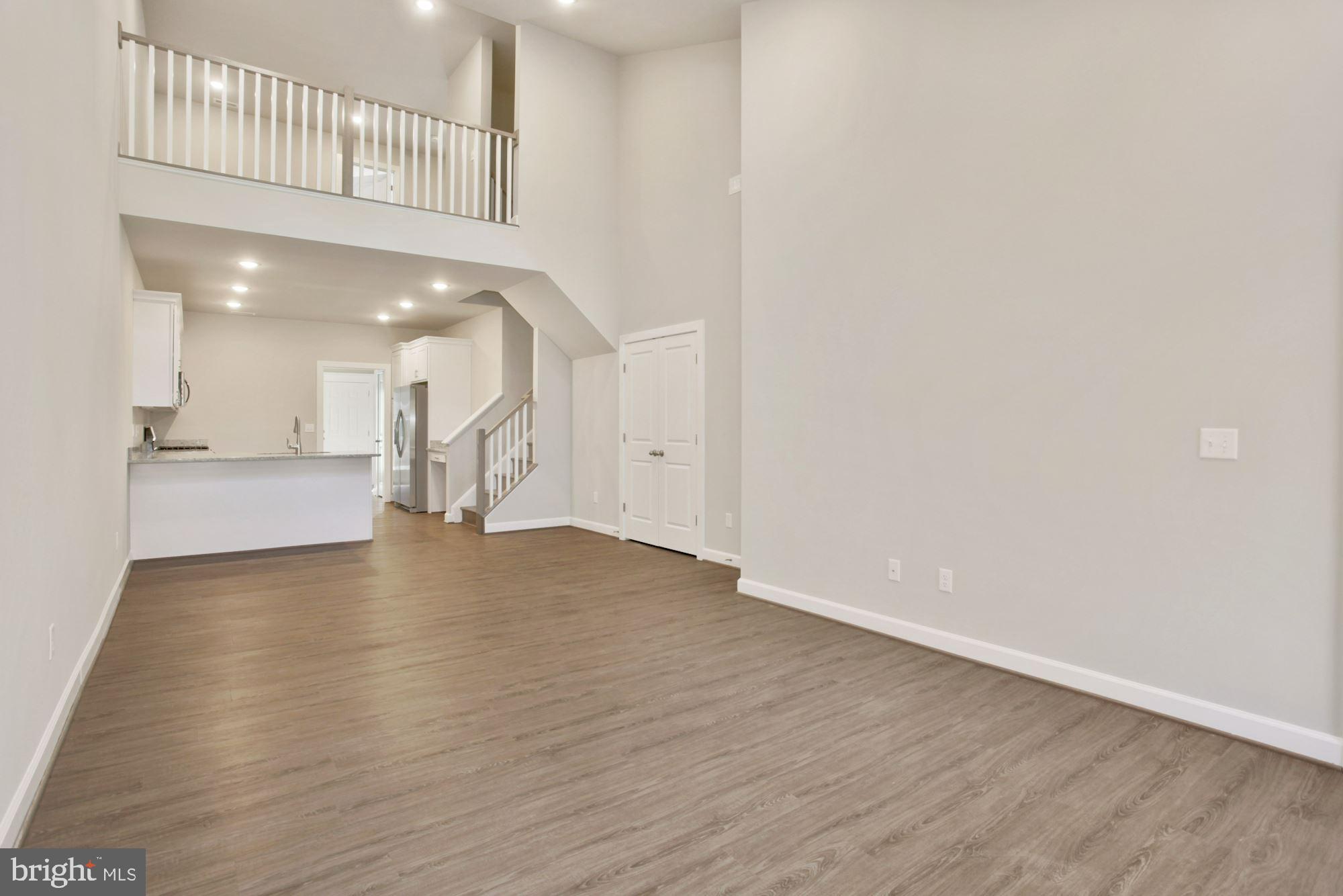 5606 Finley Rose Court Fredericksburg, VA 22407 - Photo 8 of 23 a view of an empty room with wooden floor