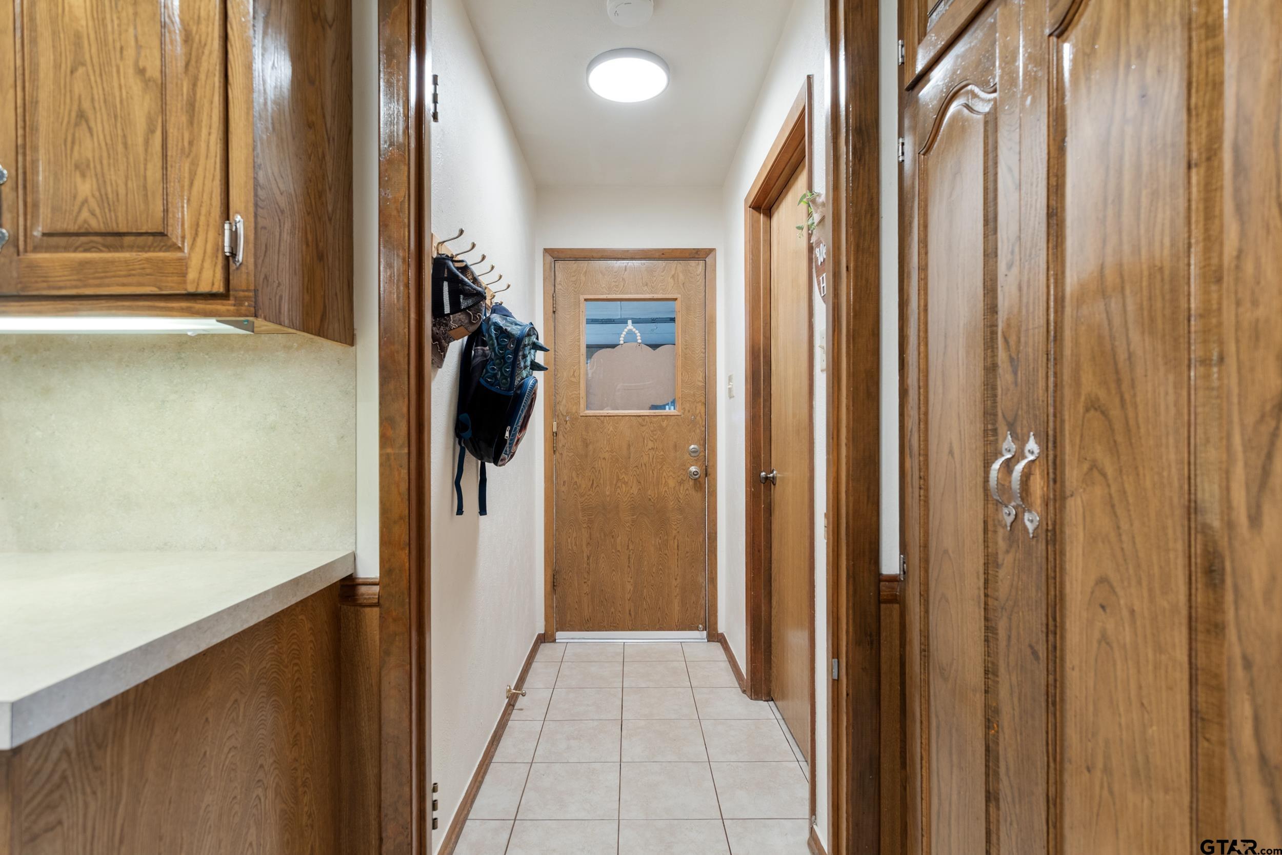 516 Ruthlynn Drive Longview, TX 75605 - Photo 14 of 34 a view of hallway with shower and wooden floor