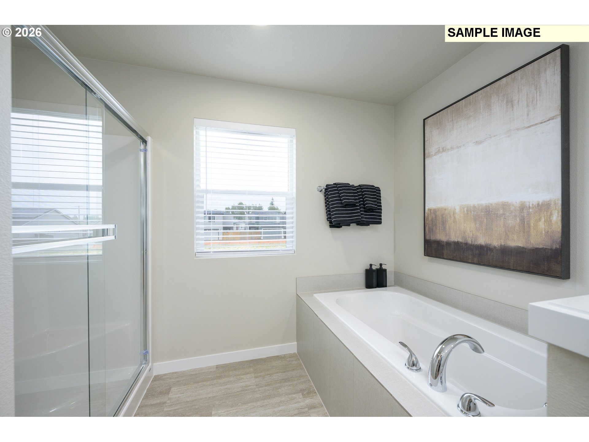 3159 South Kodiak Street, Unit L797 Cornelius, OR 97113 - Photo 16 of 18 a bathroom with a tub sink and mirror