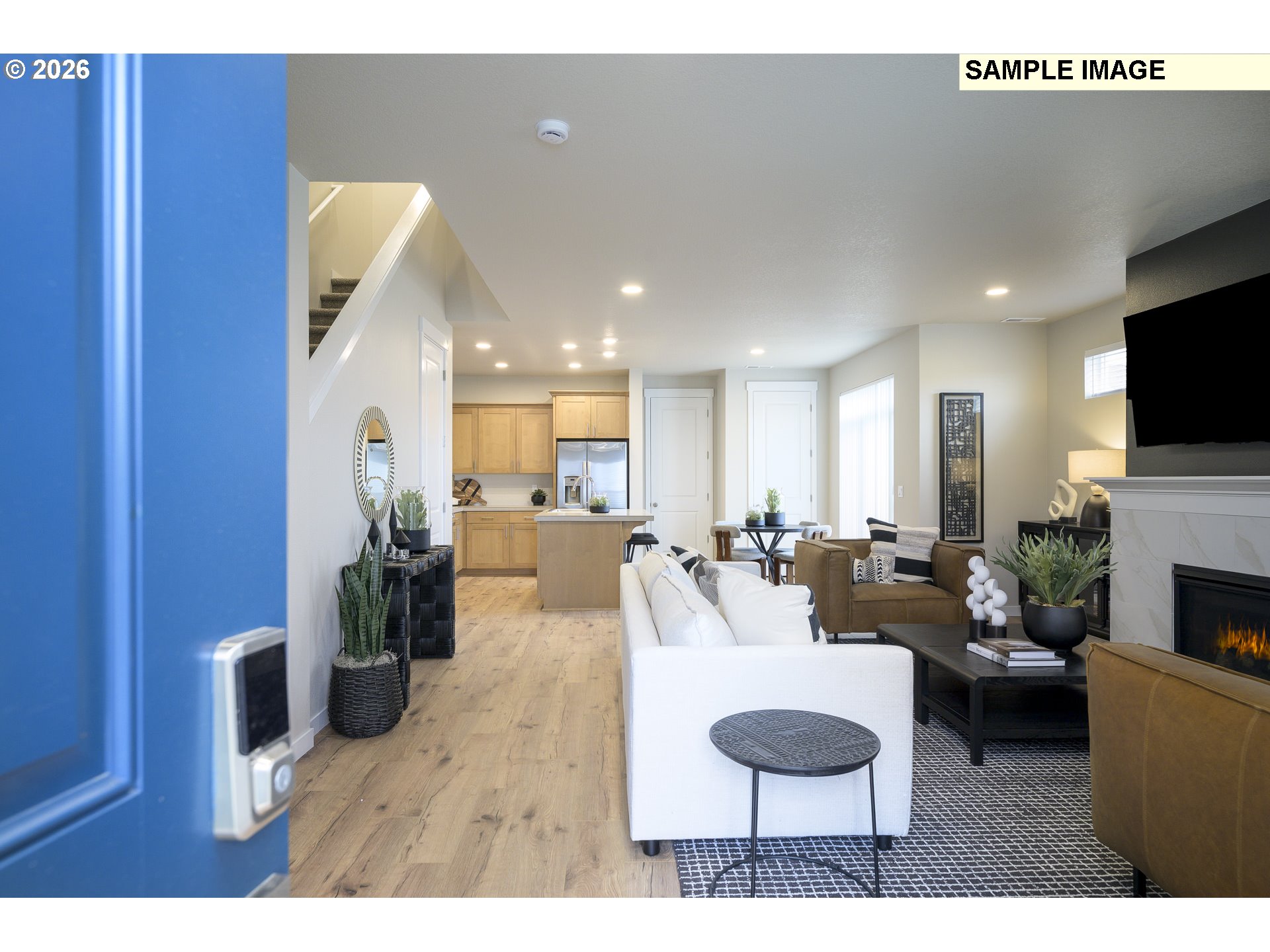 3159 South Kodiak Street, Unit L797 Cornelius, OR 97113 - Photo 2 of 18 a living room with furniture a fireplace and a flat screen tv