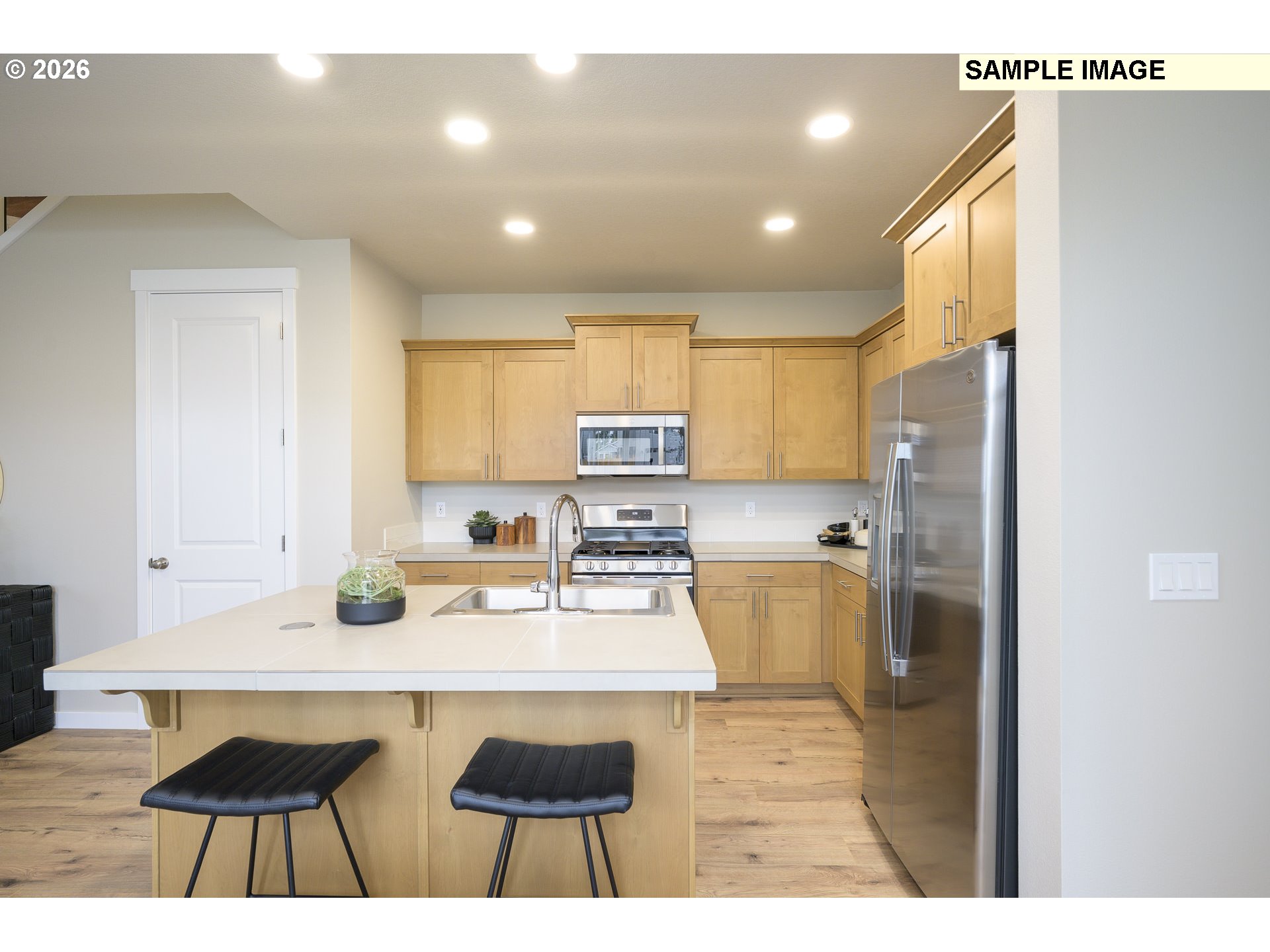 3159 South Kodiak Street, Unit L797 Cornelius, OR 97113 - Photo 8 of 18 a kitchen with refrigerator and cabinets