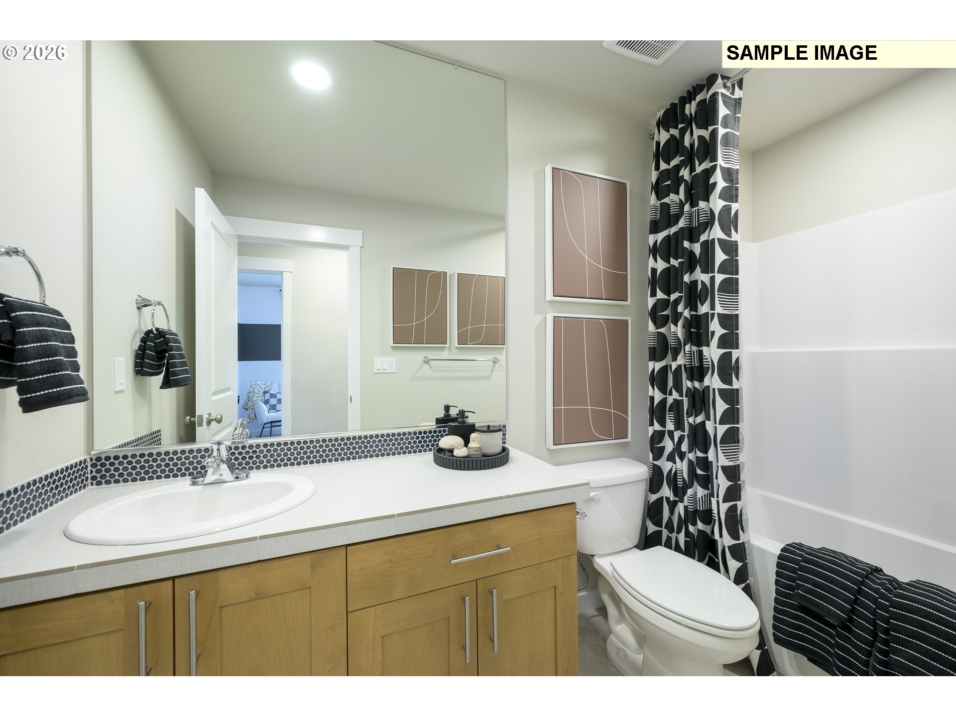 3159 South Kodiak Street, Unit L797 Cornelius, OR 97113 - Photo 10 of 18 a bathroom with a sink a toilet a shower and a mirror