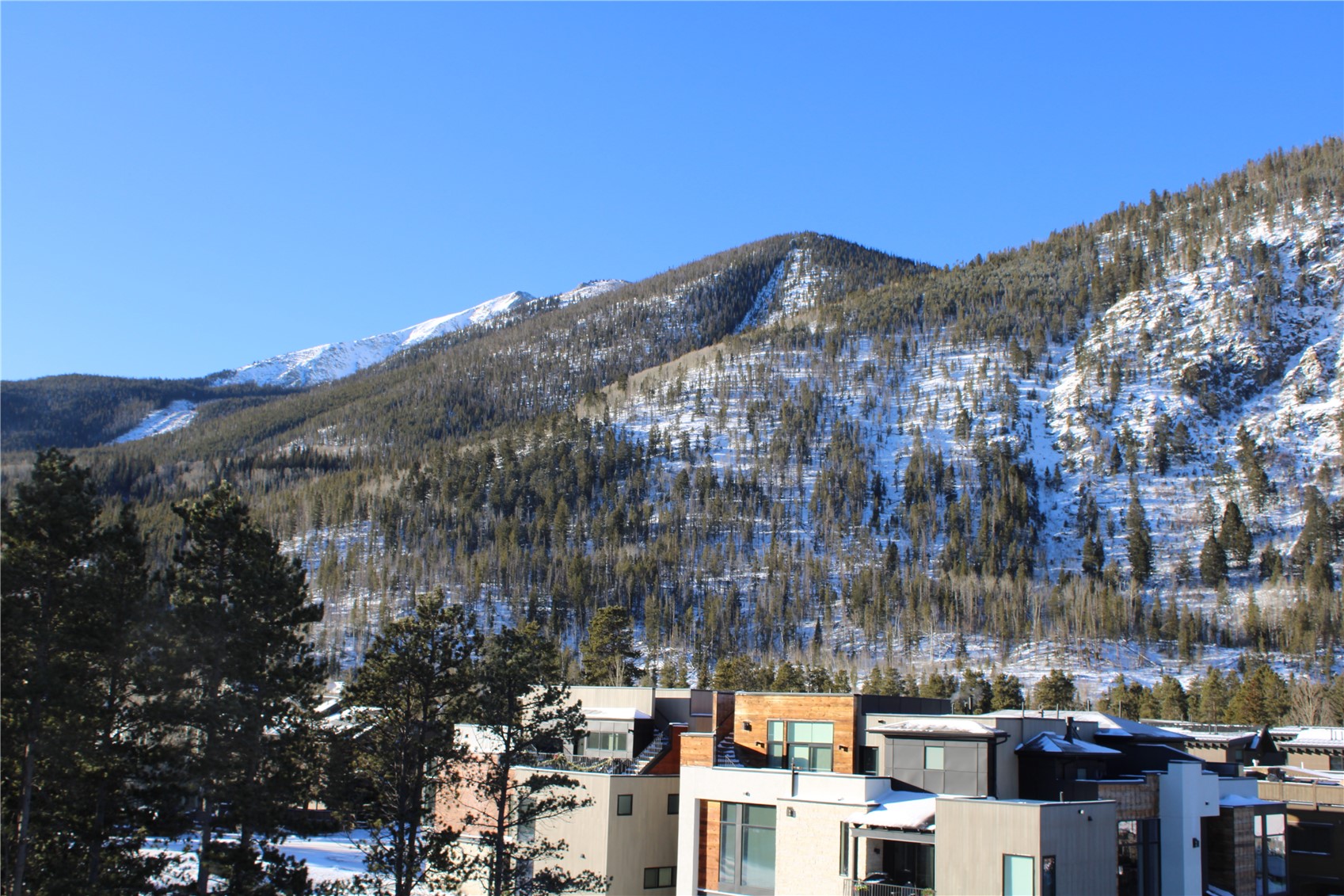 302 Teller Street, Unit 4 Frisco, CO 80443 - Photo 14 of 17 a view of a city with tall buildings