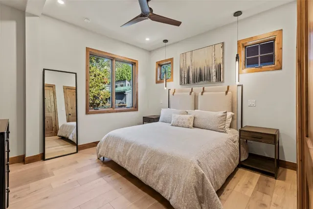 a bedroom with a large bed and a window