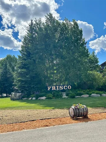 a backyard of a house with lots of green space and outdoor seating