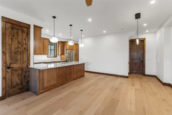 a bathroom with a double vanity sink toilet and shower