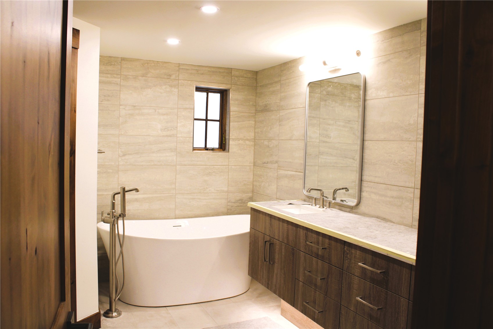 302 Teller Street, Unit 4 Frisco, CO 80443 - Photo 10 of 17 a bathroom with a bathtub sink and mirror