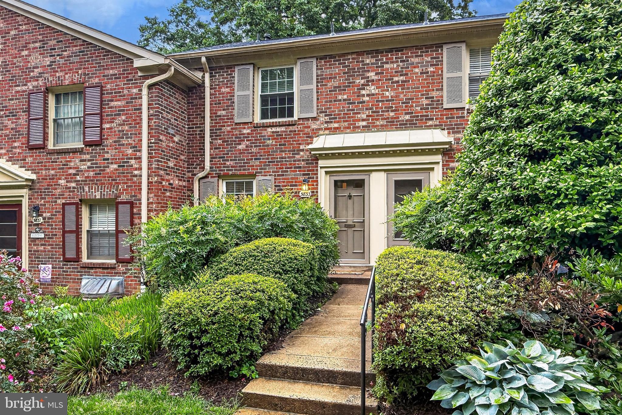 5833 Royal Ridge Drive, Unit 943 Springfield, VA 22152 - Photo 45 of 45 front view of a house with a small yard