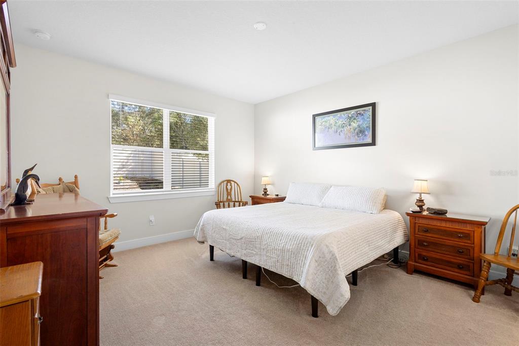 2024 Canopy Terrace Boulevard DeLand, FL 32724 - Photo 13 of 25 a bedroom with a bed and wooden floor