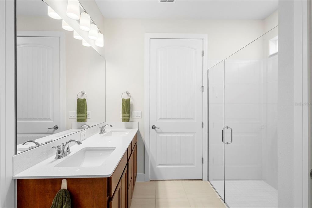 2024 Canopy Terrace Boulevard DeLand, FL 32724 - Photo 17 of 25 a bathroom with a sink double vanity and a mirror