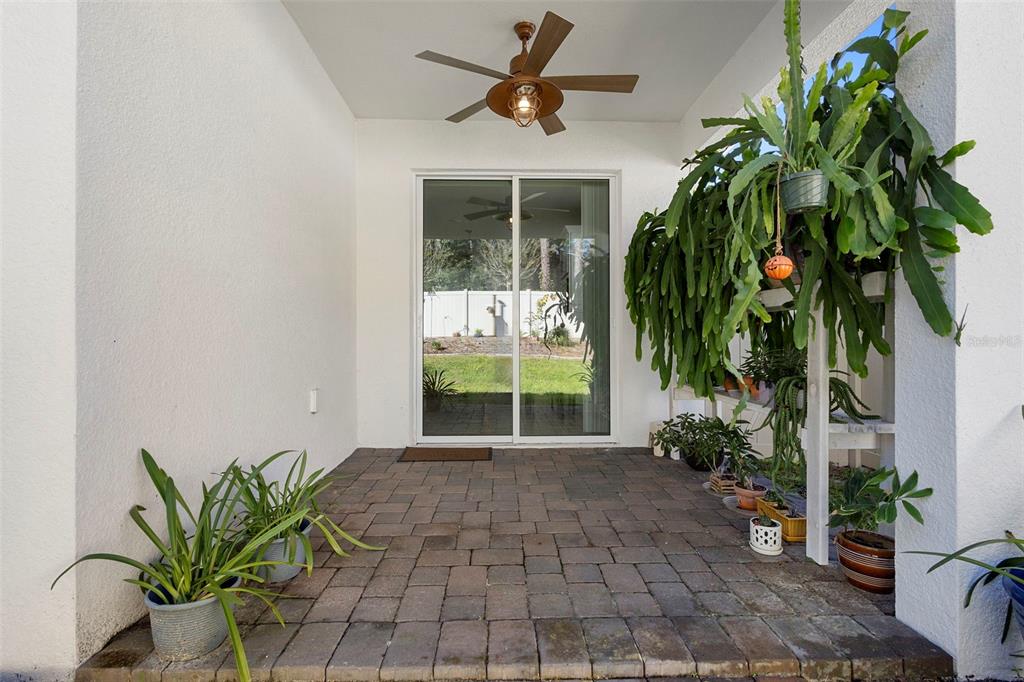 2024 Canopy Terrace Boulevard DeLand, FL 32724 - Photo 20 of 25 a vase with flowers sitting on a floor in front of a house